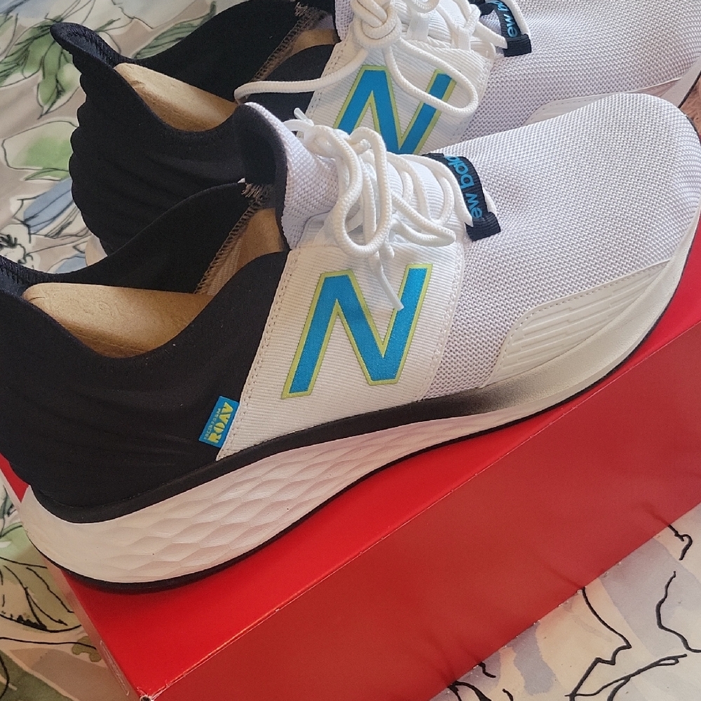 New Balance Mens White and Black Sneakers with Blue Highlights